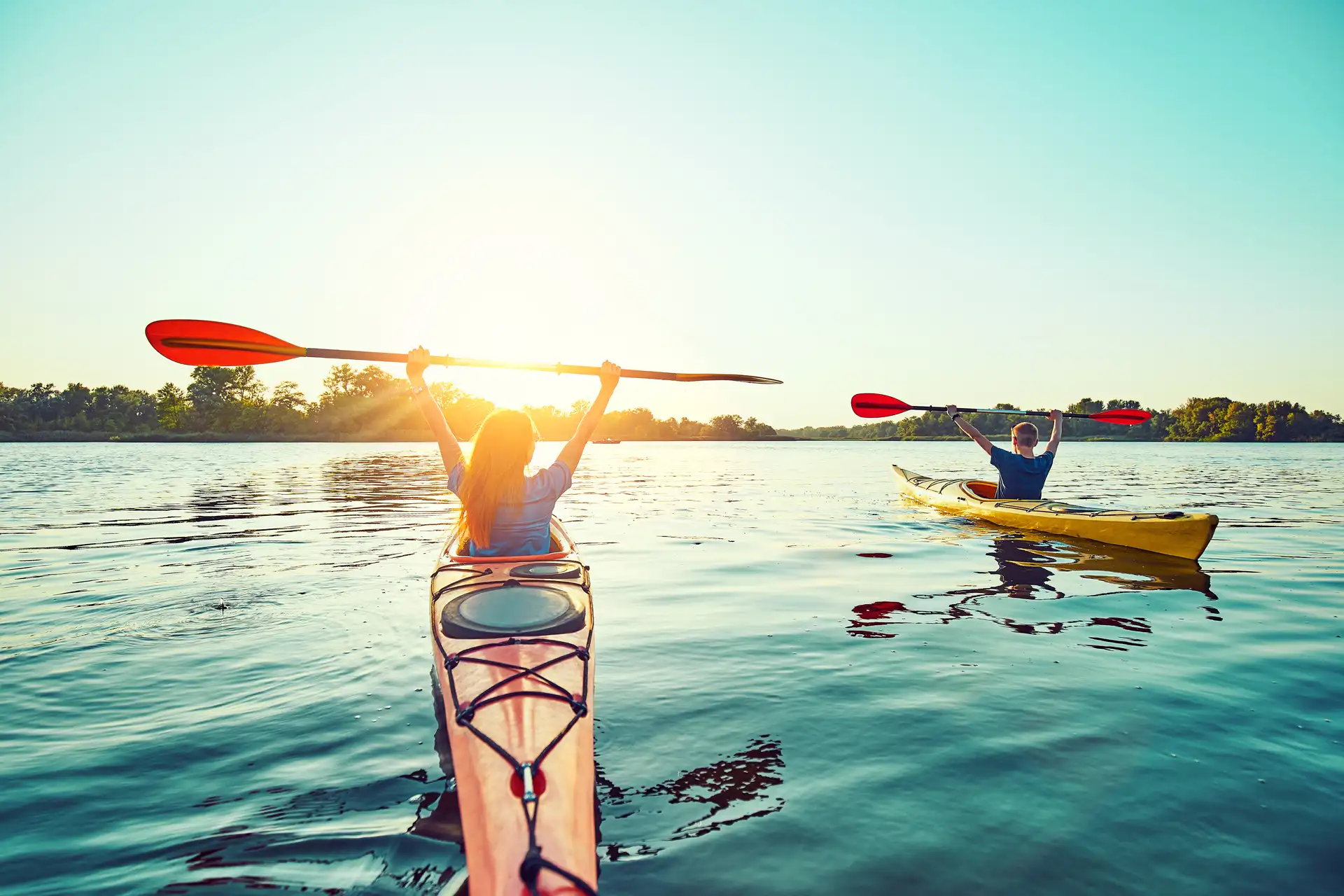 Two kayaks at sunrise on the bathing lake in Carinthia during an active holiday at Lake Wörthersee